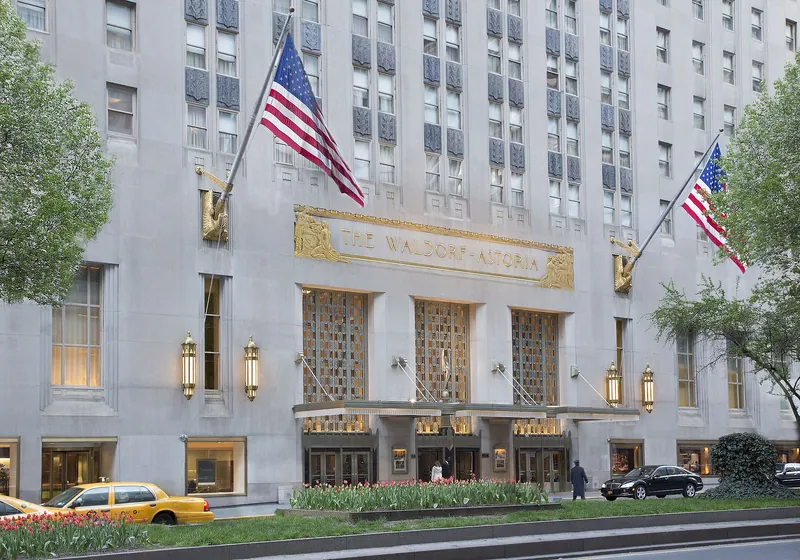 Waldorf Astoria Park Avenue entrance with flags and gilded lettering