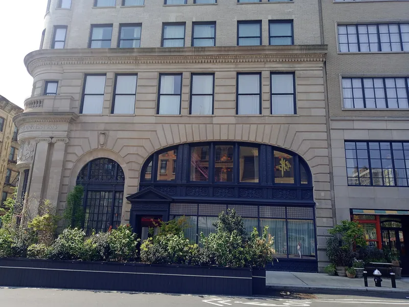 Arched ground floor of the Jarmulowsky Bank Building with planters