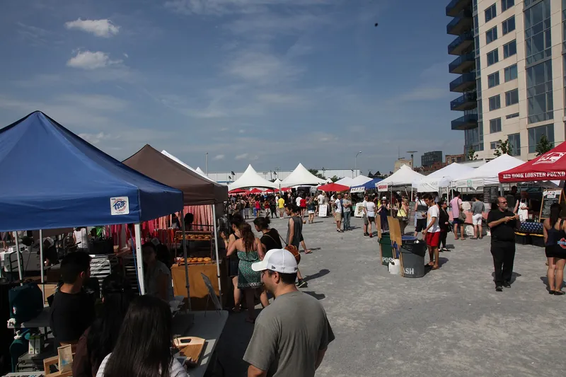 Tents and crowds at Smorgasburg on a sunny day